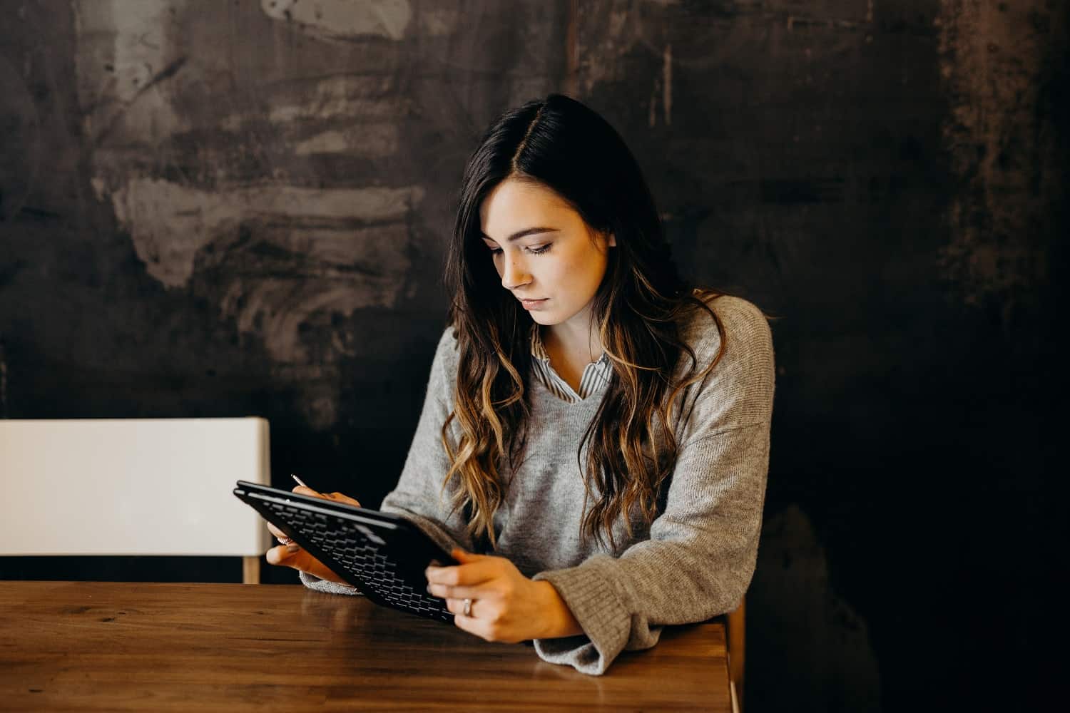 teacher working easy summer jobs on her tablet