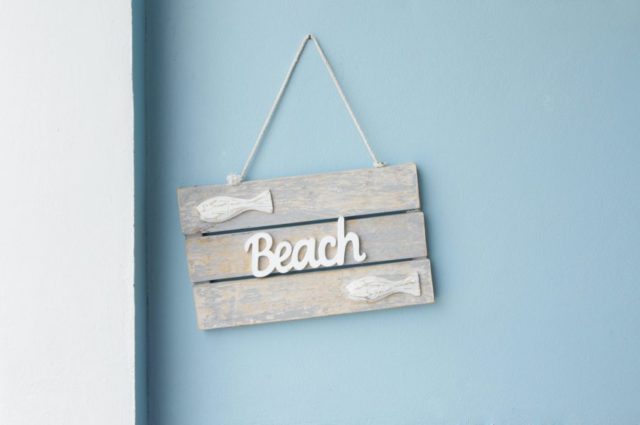 Beach slogan on wooden sign