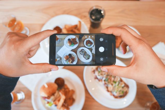 person taking photo for food blog