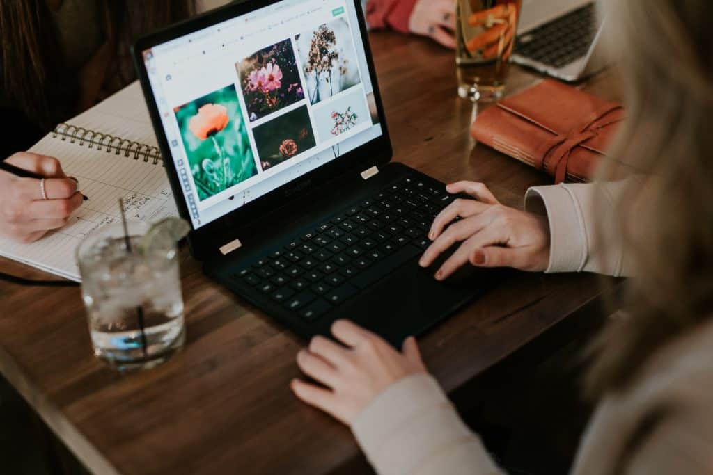 woman editing photos on a laptop