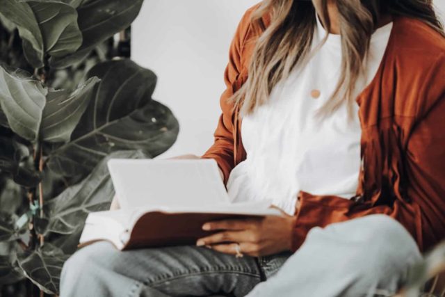 woman proofreading a book