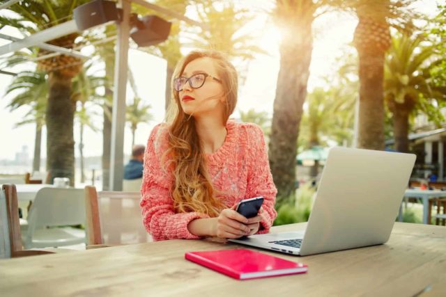 woman working on laptop outside