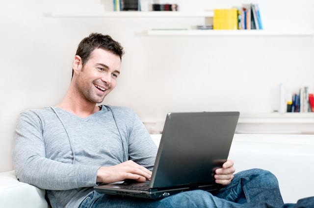 man research side hustles for men on a laptop