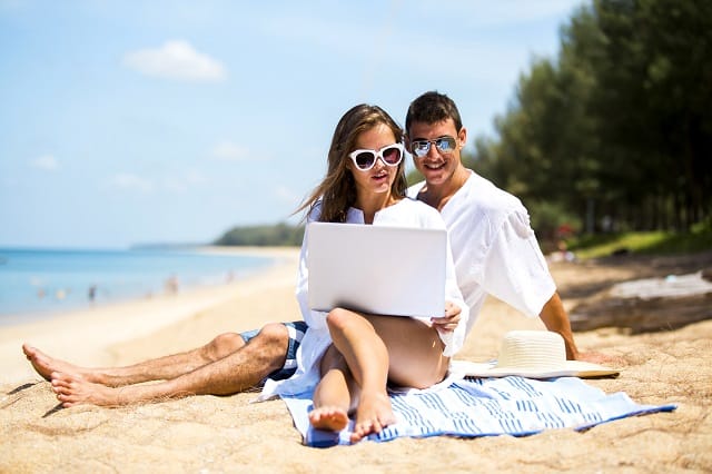 couple working jobs that feel like vacation on a beach