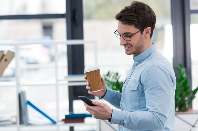 Man getting paid to answer questions on his smartphone