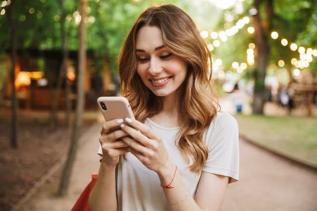 woman completing surveys on a smartphone