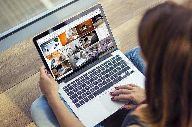 Woman managing social media on a laptop