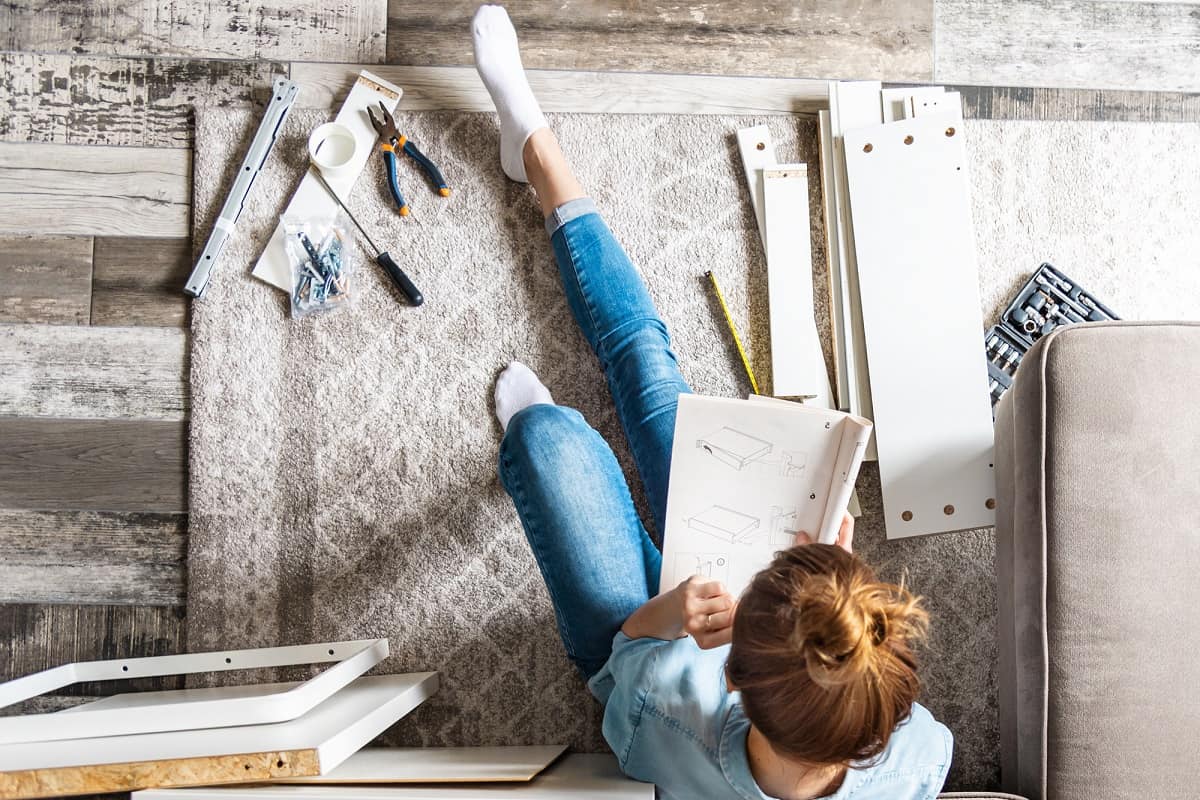 Woman assembling furniture