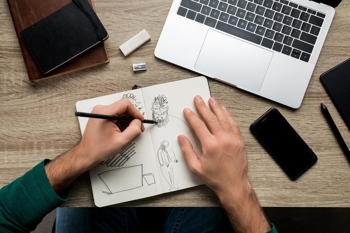 Man sketching illustrations