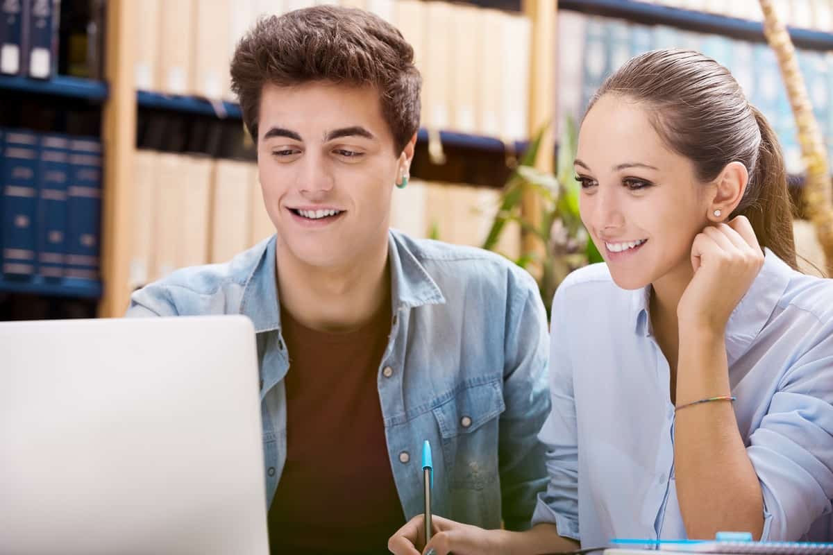 Two students researching trusted online jobs