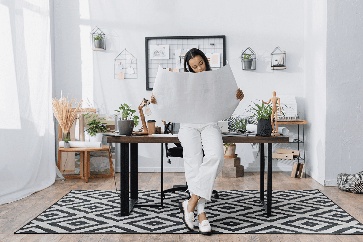 Interior designer inspecting her plans