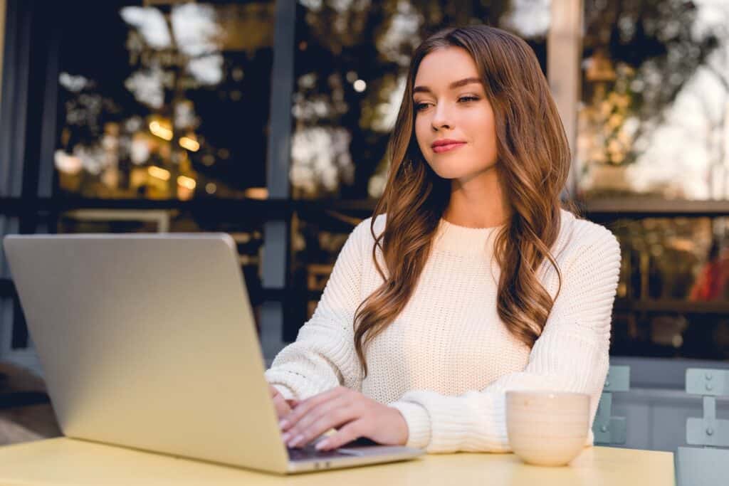 Pinterest Manager working on a laptop