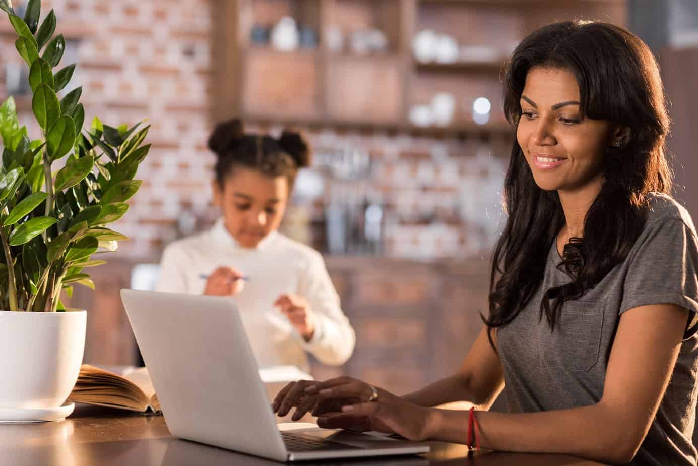 Woman searching for sleep consultant jobs on a laptop