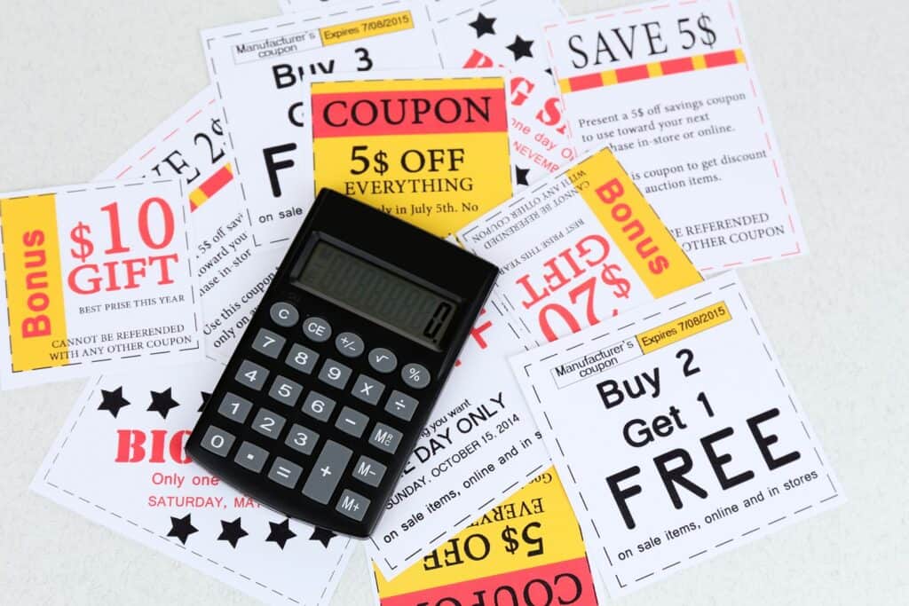 calculator on top of stack of coupons